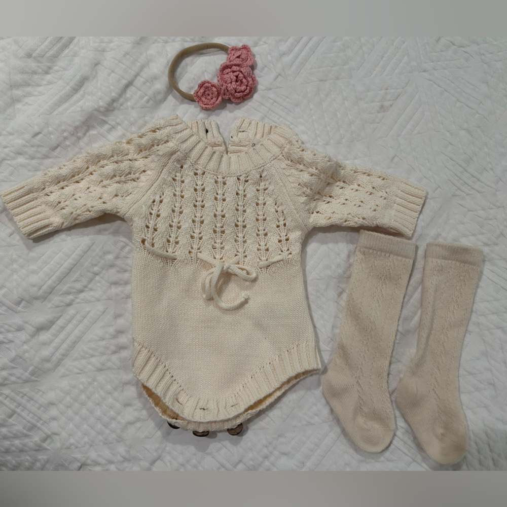 Zoya Knit Baby Romper in Cream with matching socks and pink crochet headband